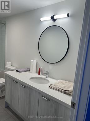 Richmond Hill apartment for rent - A bathroom with a sink, mirror, and toiletries.