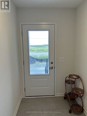 Richmond Hill apartment for rent - A wall with a thermostat and two switches.