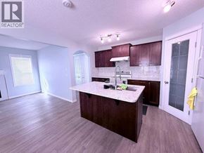 Calgary apartment for rent - A kitchen with a counter and cabinets.