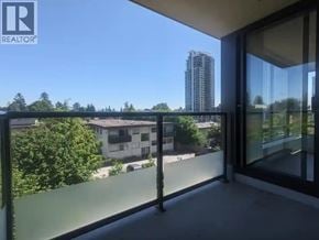Burnaby apartment for rent - A balcony with glass doors overlooking a residential area.