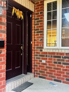 Ottawa townhouse for rent - A brown door with a glass window above it.