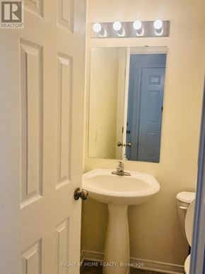 Ottawa townhouse for rent - A white pedestal sink in a small bathroom.