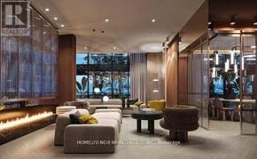 Toronto (Waterfront Communities) condo for rent - A modern living room with a seating area and a large window.