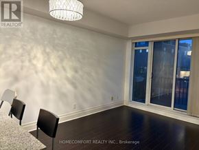 Markham (Unionville) condo for rent - A room with a table and chairs in front of a window.