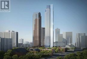 Toronto (North St. James Town) condo for rent - A cityscape with buildings and a sign for Homelife New World Realty.