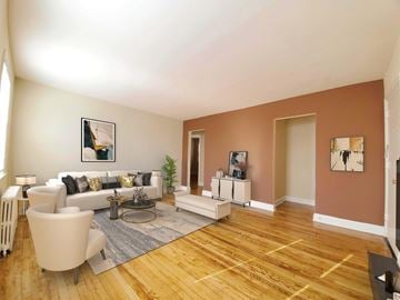 Hyattsville apartment for rent - A living room with a white couch and a grey coffee table.