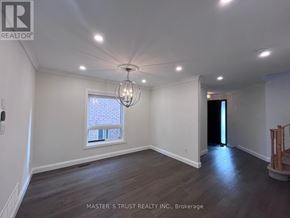 Richmond Hill (Westbrook) apartment for rent - A room with a window and a chandelier.
