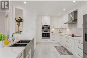 Richmond Hill (Westbrook) apartment for rent - A modern kitchen with white cabinets and stainless steel appliances.