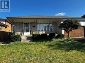 Mississauga (Erindale) apartment for rent - A house with a tree in front of it.