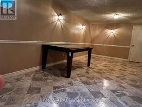 Mississauga (Erindale) apartment for rent - A room with a table and wall lights.
