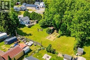 Vittoria apartment for rent - A bird flies over a green lawn in a residential area.