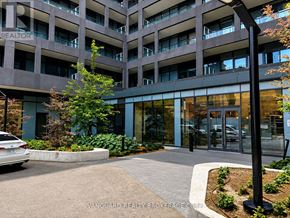 Toronto (Niagara) condo for rent - A building with a car parked in front of it.