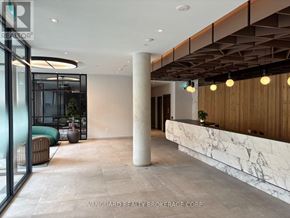 Toronto (Niagara) condo for rent - A reception area with a marble counter and a pillar.