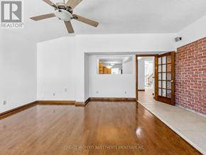 Pickering (Amberlea) apartment for rent - A room with a ceiling fan and wooden floors.