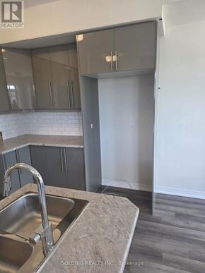 Brantford townhouse for rent - A kitchen with a sink and a counter top.