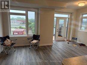Brantford townhouse for rent - A room with a window and two chairs.