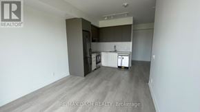 Vaughan (Steeles West Industrial) condo for rent - A kitchen area with a white fridge, a white oven, and a white dishwasher.
