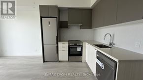 Vaughan (Steeles West Industrial) condo for rent - A kitchen with a refrigerator, dishwasher, and oven.