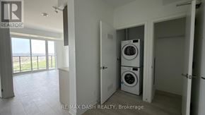 Vaughan (Steeles West Industrial) condo for rent - A laundry room with a washer and dryer in it.