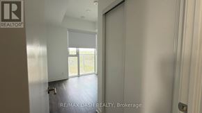 Vaughan (Steeles West Industrial) condo for rent - A room with a sliding glass door leading to a balcony.