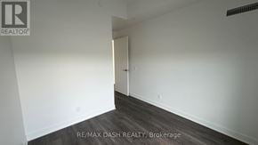 Vaughan (Steeles West Industrial) condo for rent - A room with a doorway leading to another room.