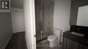 Vaughan (Steeles West Industrial) condo for rent - A bathroom with a toilet, sink, and shower.