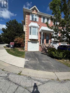 Burlington (Palmer) townhouse for rent - A red brick house with a white door and windows.