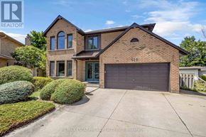 Hamilton (Butler) apartment for rent - A large brick house with a garage is for sale.