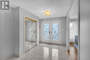 Hamilton (Butler) apartment for rent - A hallway with a glass door and a light on the ceiling.
