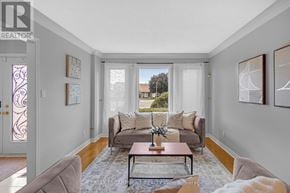 Hamilton (Butler) apartment for rent - A living room with a couch, coffee table, and pictures on the wall.