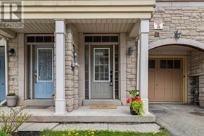 Oakville (Wm Westmount) townhouse for rent - A house with a blue door and a sign that says "LOV 36".
