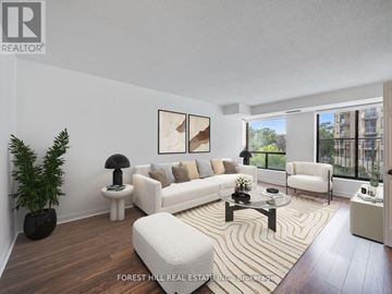 Toronto (Englemount-Lawrence) condo for rent - A living room with a white couch and a coffee table.