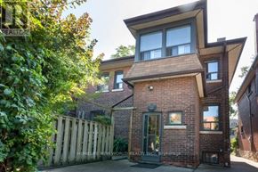 Toronto (South Parkdale) apartment for rent - A modern brick house with a large front yard.