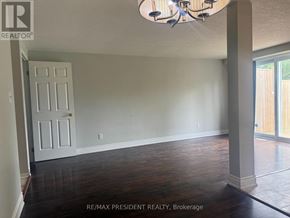 Kitchener townhouse for rent - A room with a chandelier and a door.