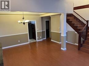 Burnaby apartment for rent - A large open room with a staircase on the right side.