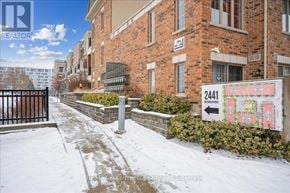 Oakville (Wm Westmount) townhouse for rent - A snowy street with a sign for 24A1.