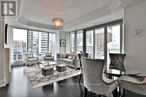 Toronto (Annex) condo for rent - A living room with a glass table and grey chairs.