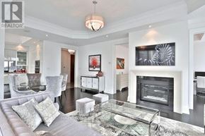 Toronto (Annex) condo for rent - A living room with a grey couch and a glass coffee table.