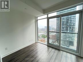 Toronto (Church-Yonge Corridor) condo for rent - A room with a view of the city through large windows.