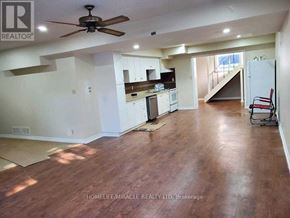 Uxbridge apartment for rent - A living room with wood flooring and a ceiling fan.