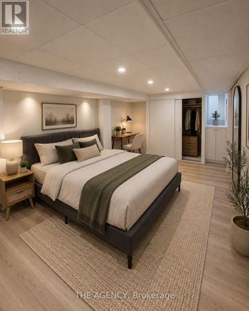 Toronto (Princess-Rosethorn) apartment for rent - A bedroom with a large bed and a rug on the floor.