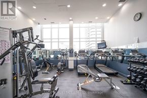 Toronto (Niagara) condo for rent - A gym with a variety of equipment including treadmills, weights, and exercise machines.