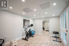 Toronto (Niagara) condo for rent - A room with a bicycle and a mirror on the wall.