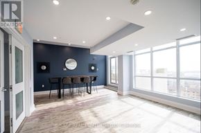 Toronto (Niagara) condo for rent - A spacious room with a dining table and chairs.