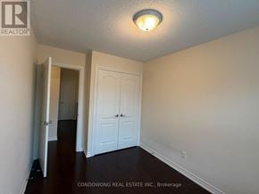 Markham (Cathedraltown) townhouse for rent - A room with a white door and a light on the ceiling.