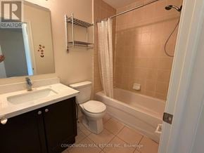 Markham (Cathedraltown) townhouse for rent - A bathroom with a sink, toilet, and bathtub.