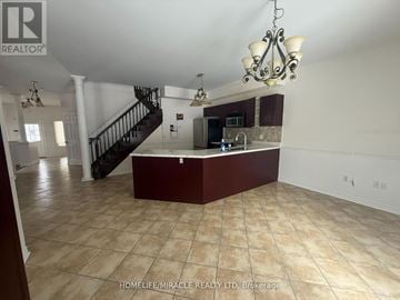 Barrie (Ardagh) apartment for rent - A spacious kitchen and living room with a staircase in the background.