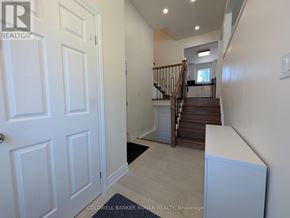 Georgina (Keswick South) apartment for rent - A hallway with a staircase leading to the second floor.