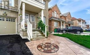 Brampton (Bram East) apartment for rent - A house with a driveway and a car parked in front.