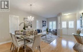 Brampton (Bram East) apartment for rent - A dining room with a glass table and chairs.